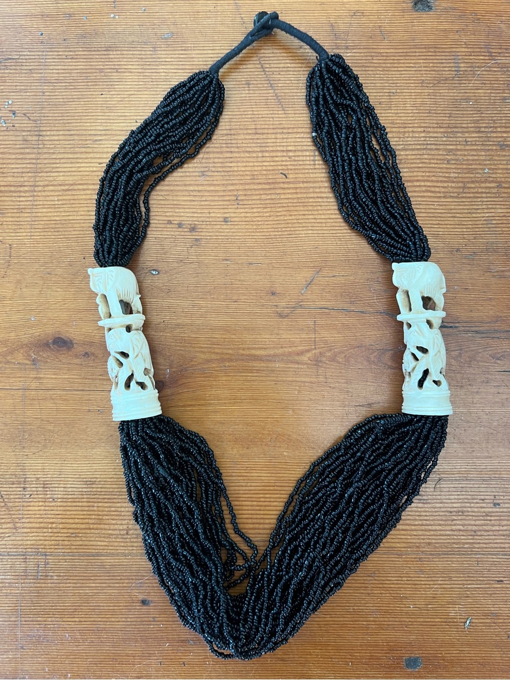 Black Multi-Strand Beaded Necklace with Carved Ivory Accents
